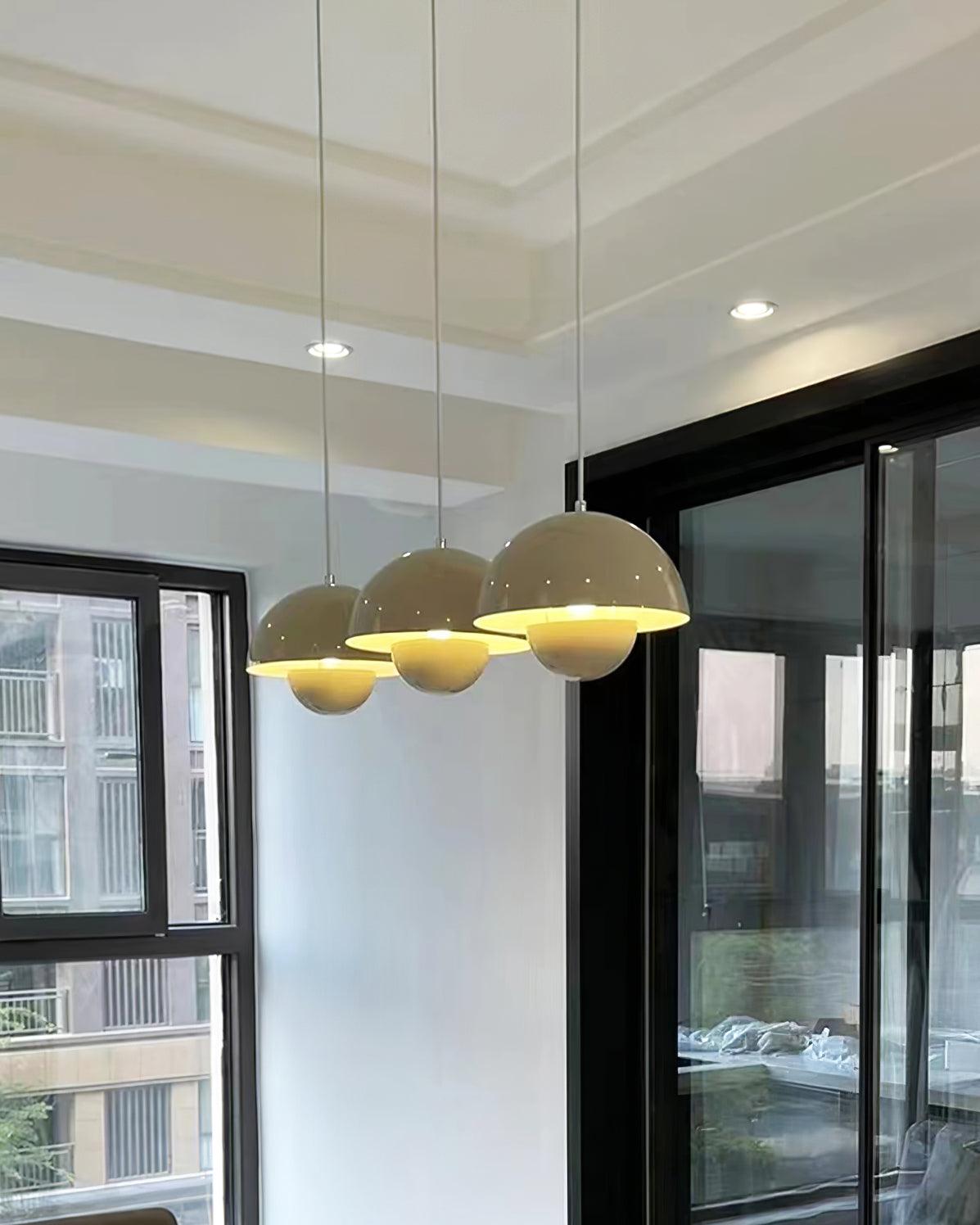 Beige dome pendants above a table