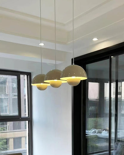 Beige dome pendants above a table