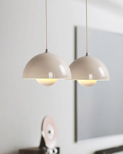 White dome pendants above a table