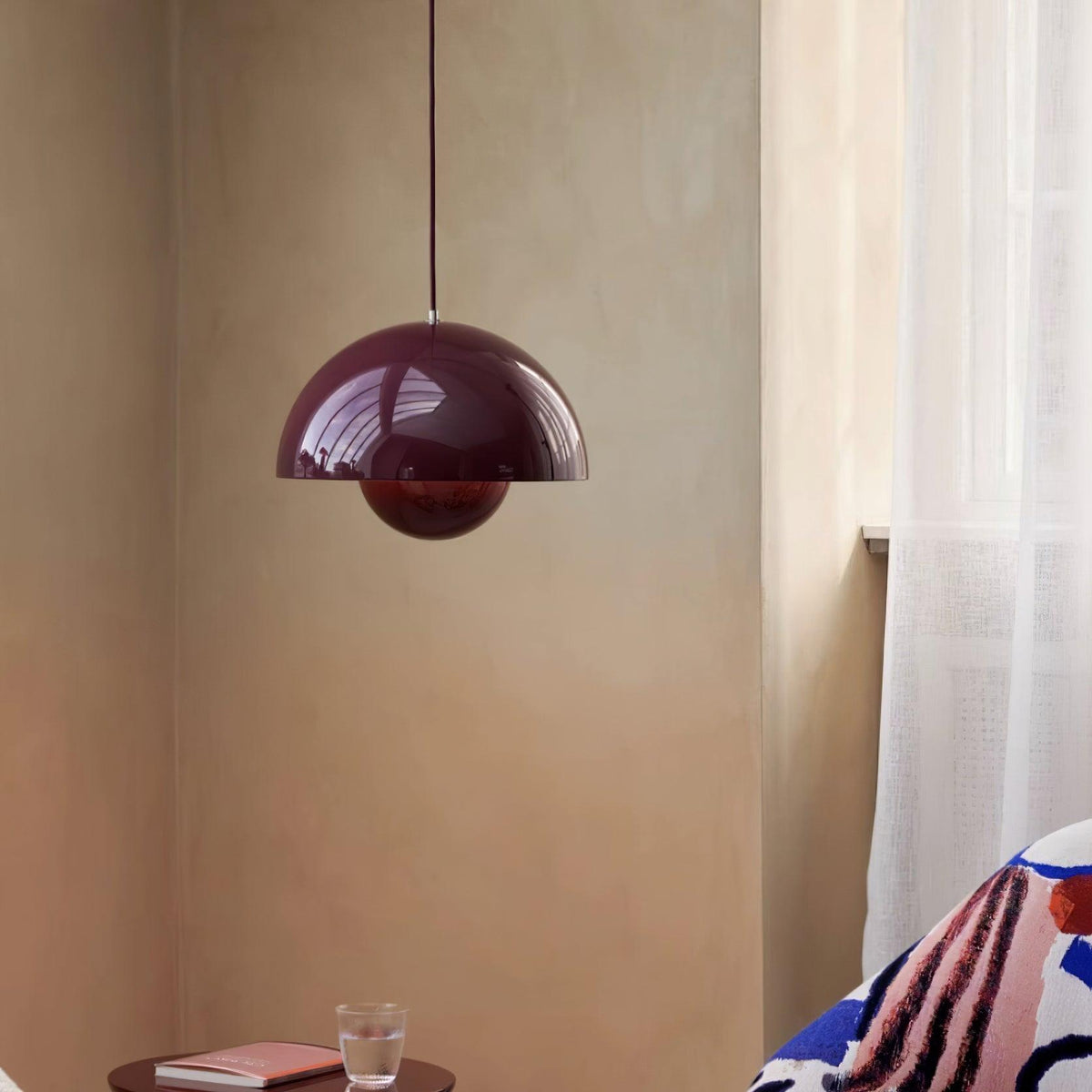 Purple dome pendant beside a sofa