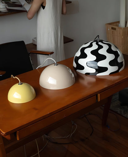 Dome pendant shades on a table
