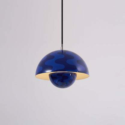 Blue patterned dome pendant with light on