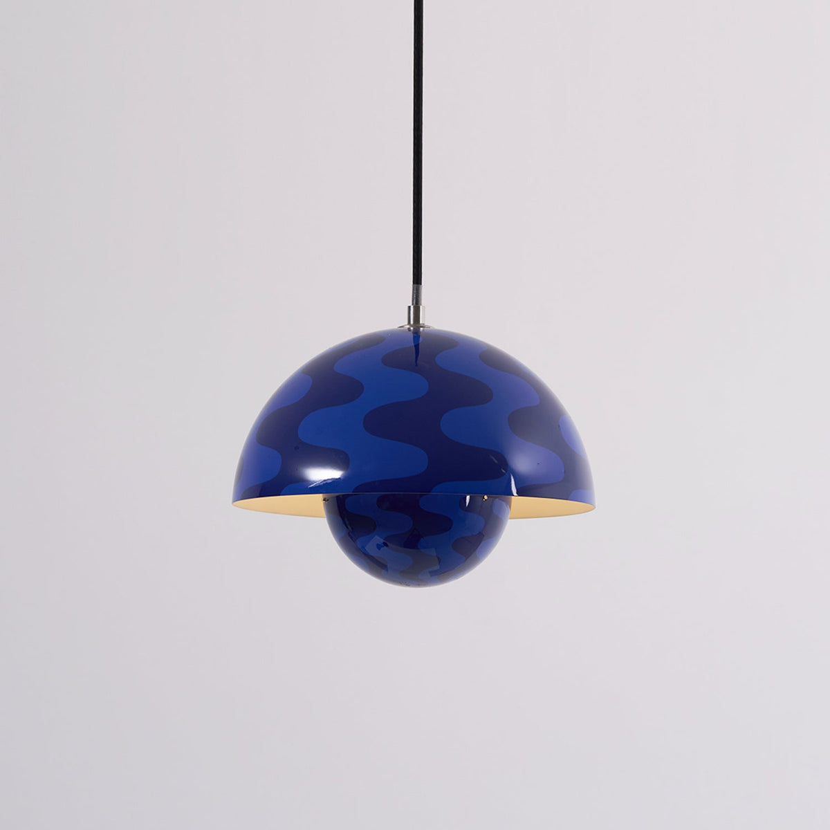 Blue patterned dome pendant with warm illumination