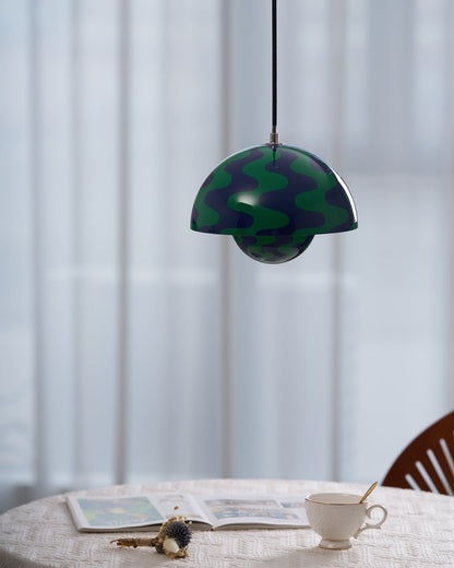 Close view of green and blue patterned pendant