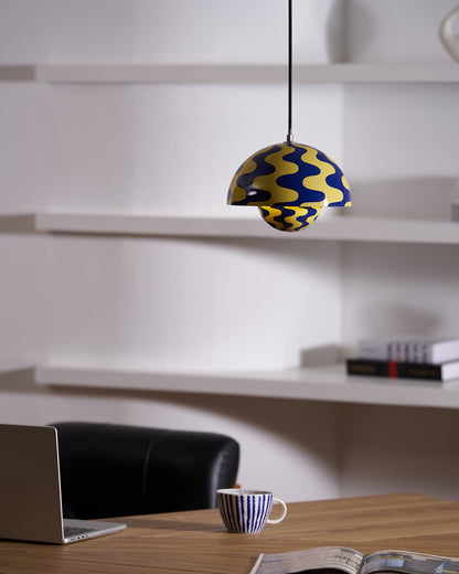 Patterned yellow and blue pendant beside shelving
