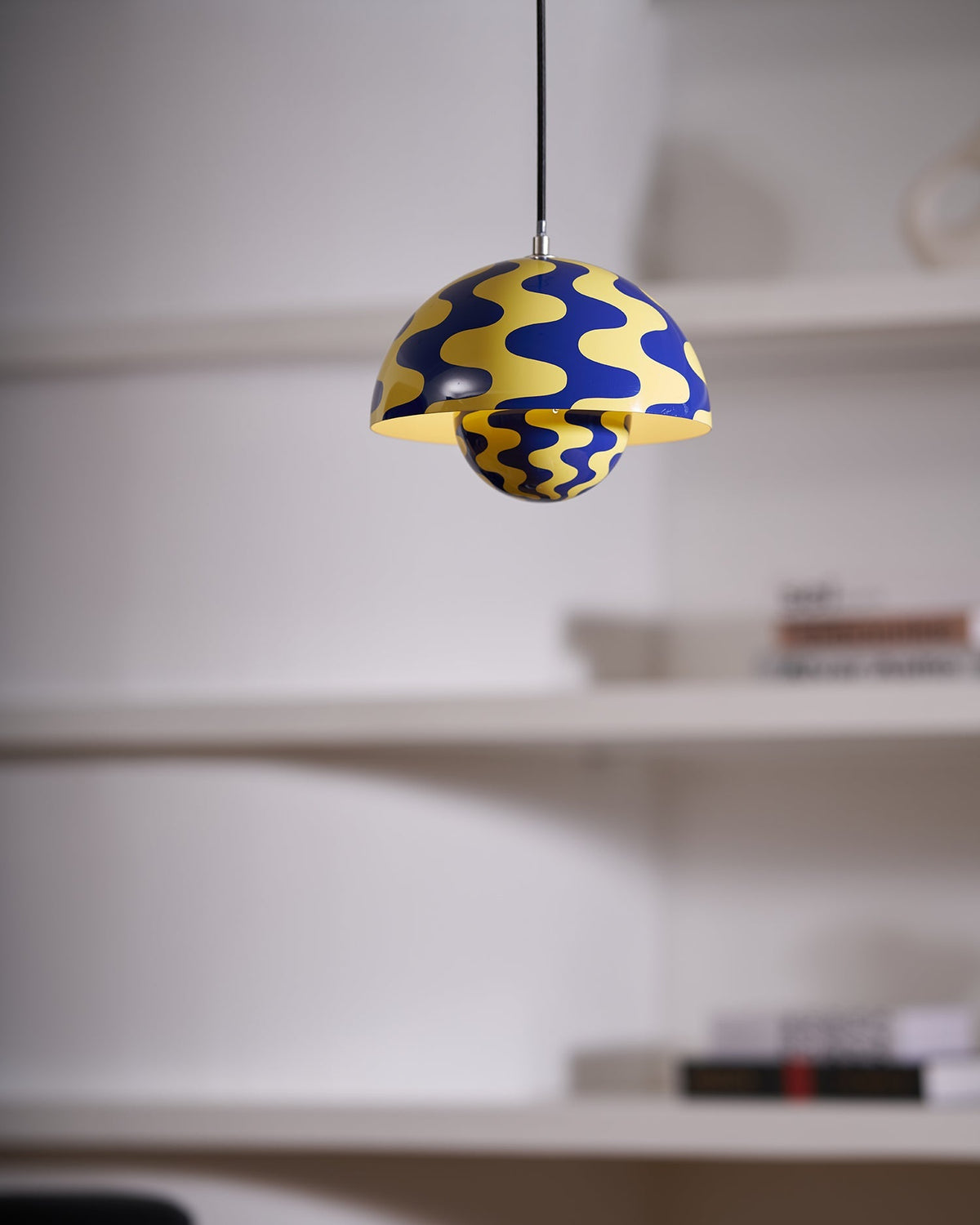 Close view of blue and yellow dome pendant