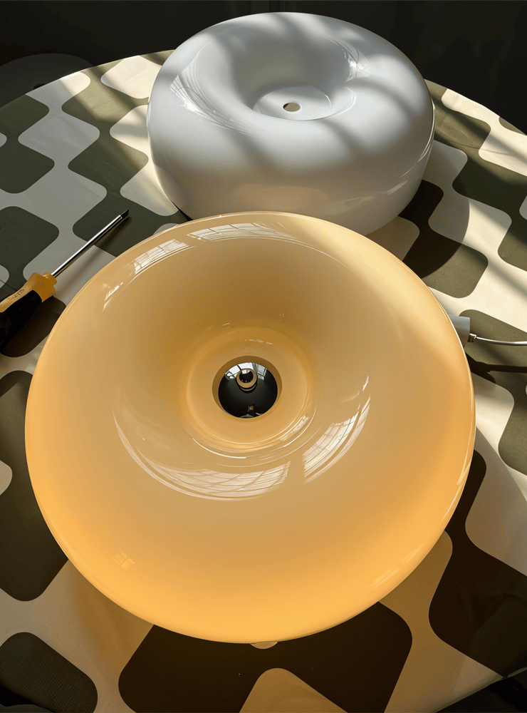 Donut glass ceiling light shades showing their central fittings
