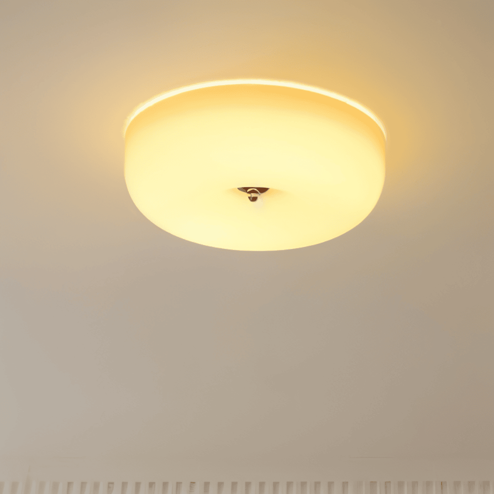 Illuminated donut glass flush ceiling light with a warm glow