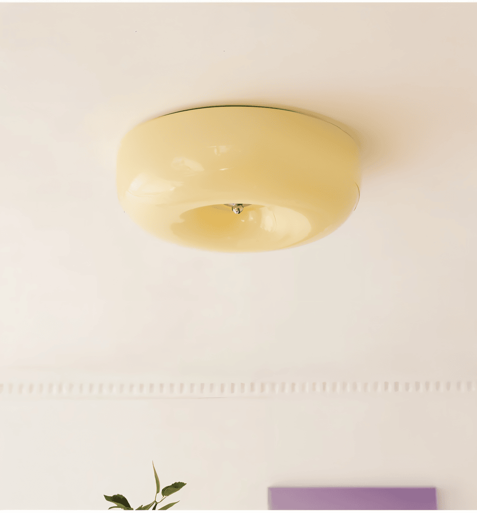 Beige donut glass ceiling light in an interior setting