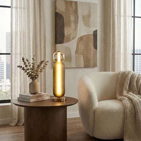 Smoky grey and amber lamp beside an armchair