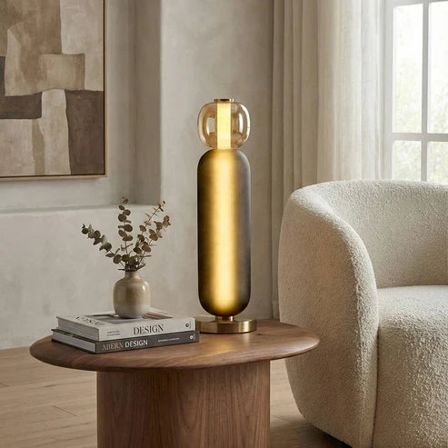 Smoky grey glass lamp on a side table
