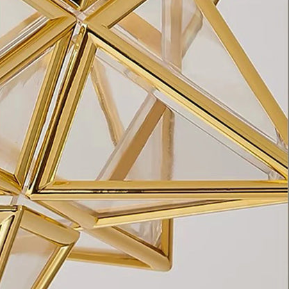Close-up of a modern five-pointed star flush mount ceiling light featuring a geometric gold metal frame with clear glass panels for indoor lighting.