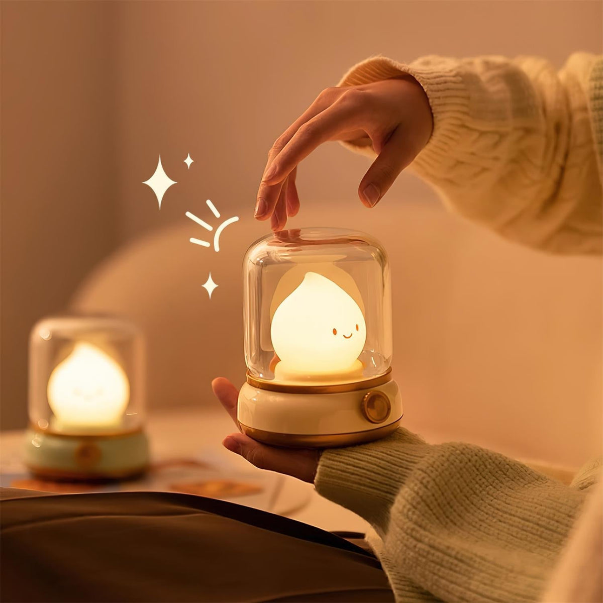 Hand touching the clear cover of a flame-shaped LED bedside lamp
