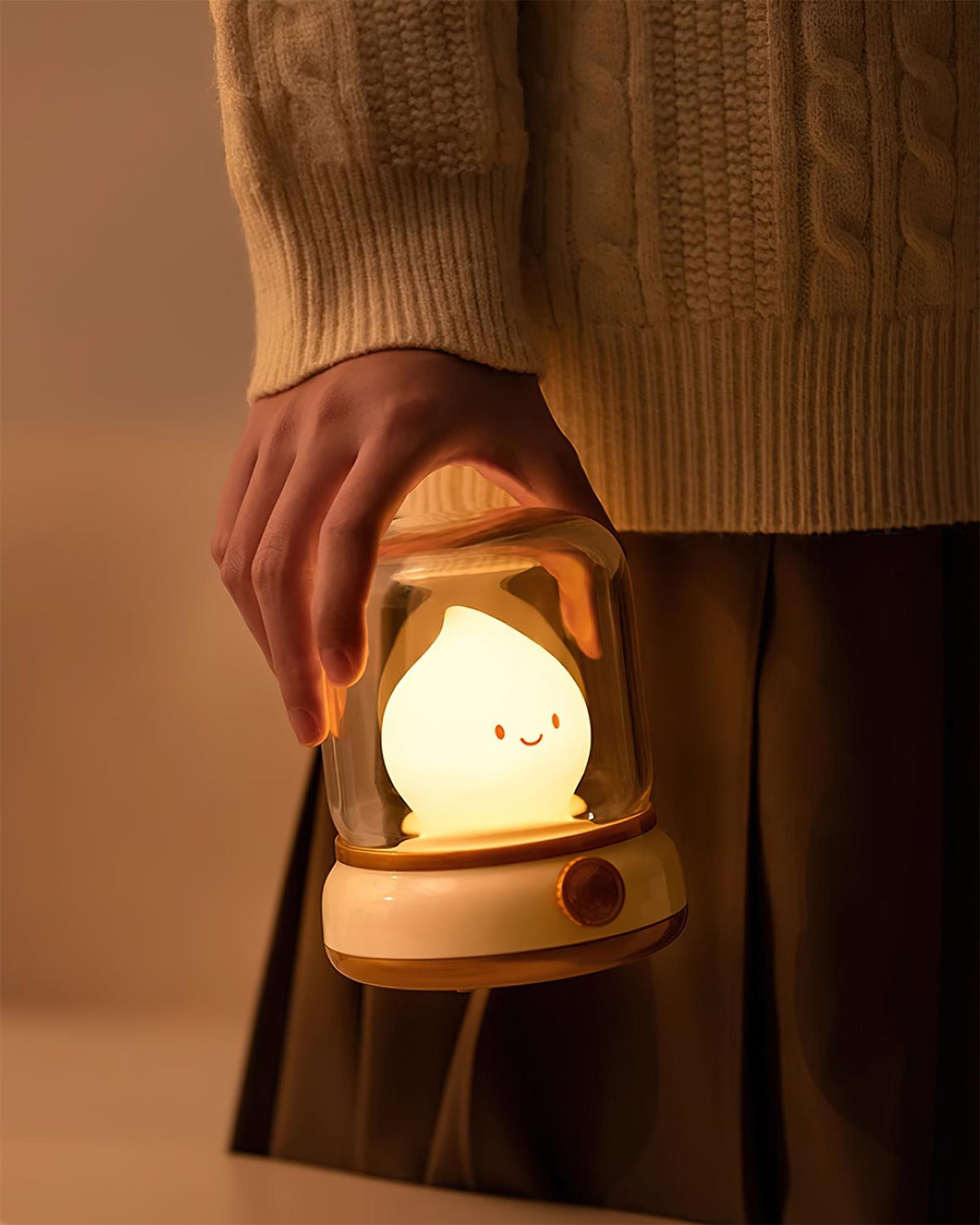 Beige lantern-style LED bedside lamp with glowing flame-shaped light 16
