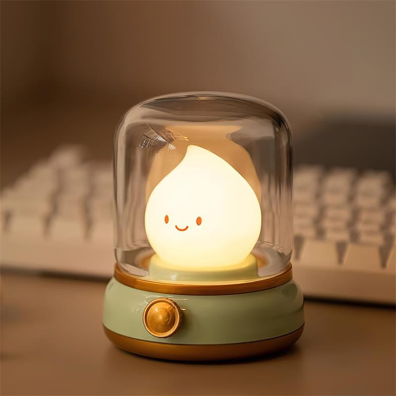 Green lantern-style LED bedside lamp with glowing flame-shaped light 2