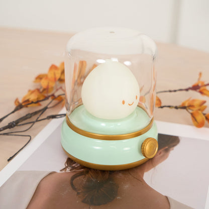 Green lantern-style LED bedside lamp with glowing flame-shaped light 25