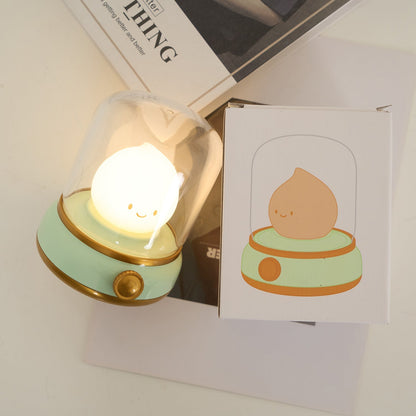 Green lantern-style LED bedside lamp with glowing flame-shaped light 31