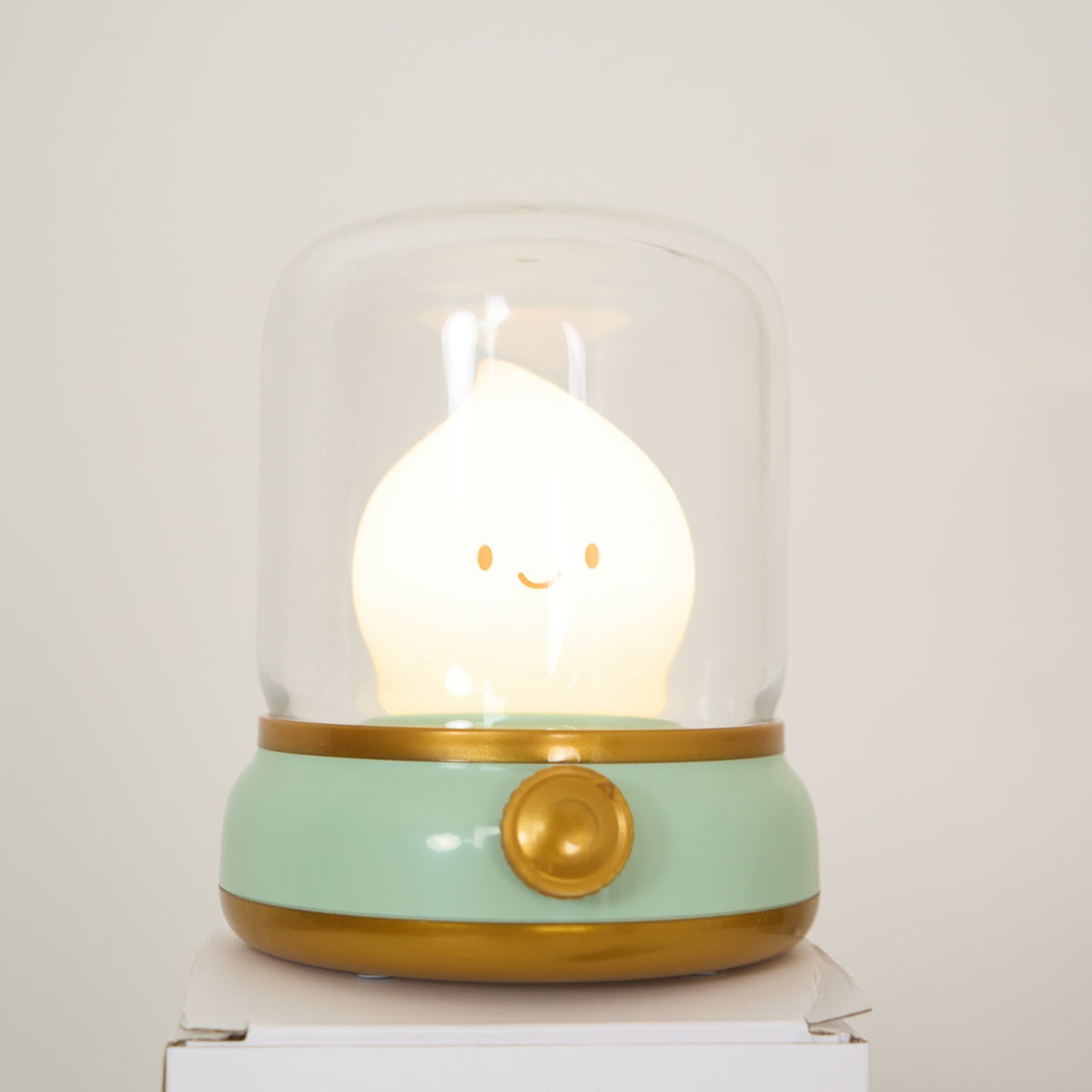 Green lantern-style LED bedside lamp with glowing flame-shaped light 33