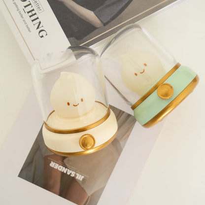Green and beige flame-shaped LED lamps with clear lantern covers