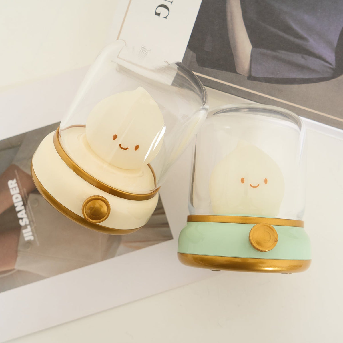 Green and beige flame-shaped LED lamps with clear lantern covers