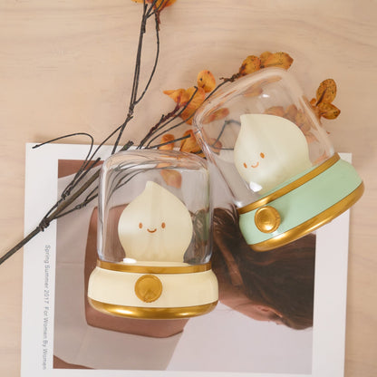 Green and beige flame-shaped LED lamps with clear lantern covers