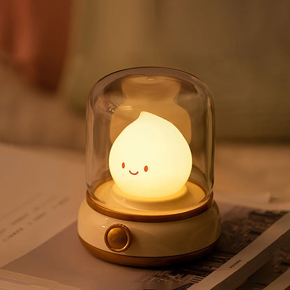 Beige lantern-style LED bedside lamp with glowing flame-shaped light 4