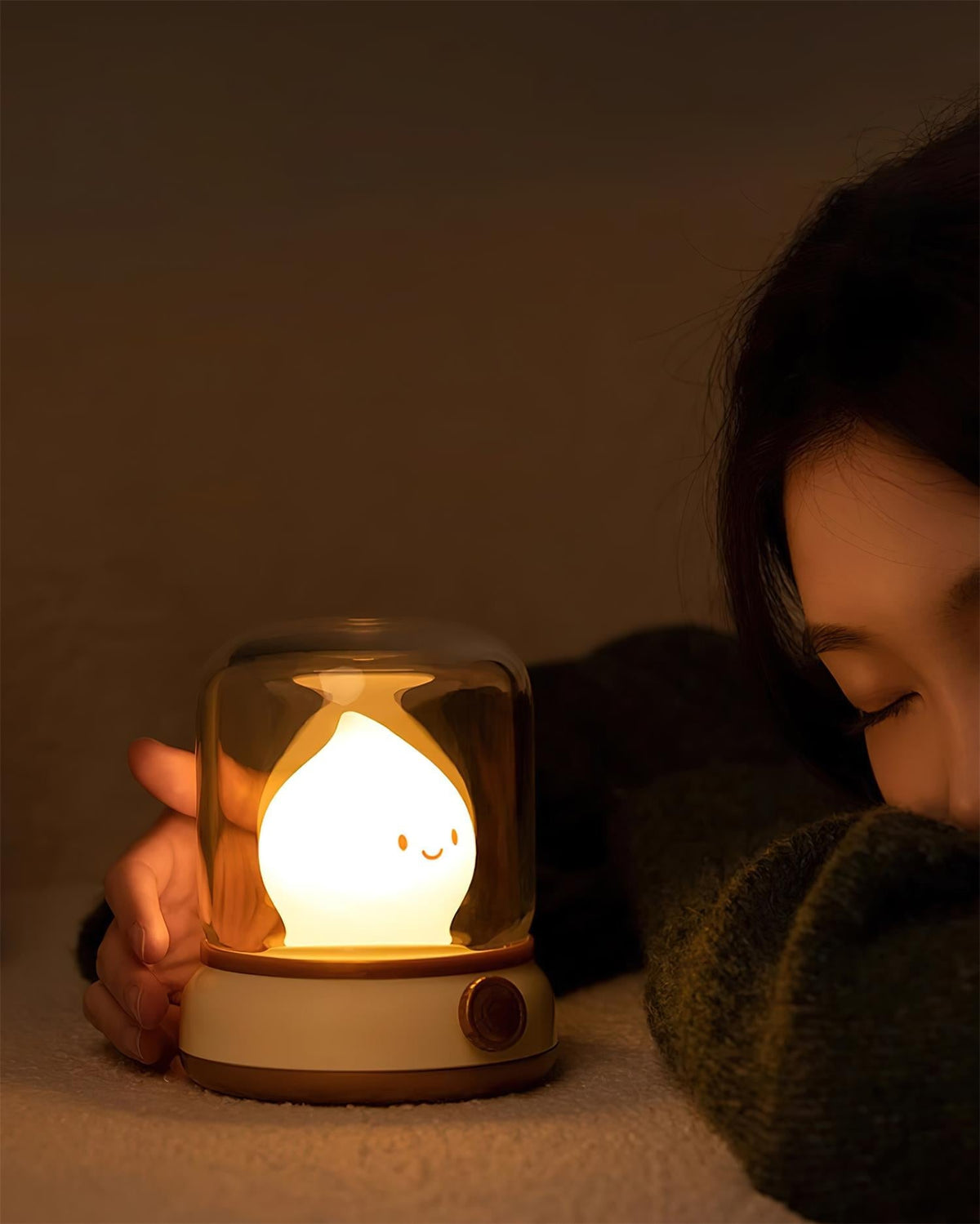Beige lantern-style LED bedside lamp with glowing flame-shaped light 6