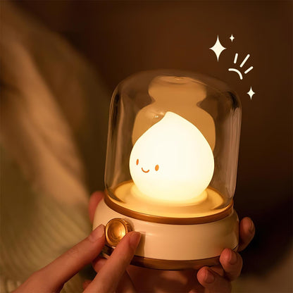Beige lantern-style LED bedside lamp with glowing flame-shaped light 8