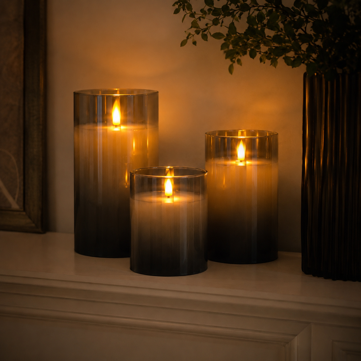 Three gray flameless LED candles with graduated heights