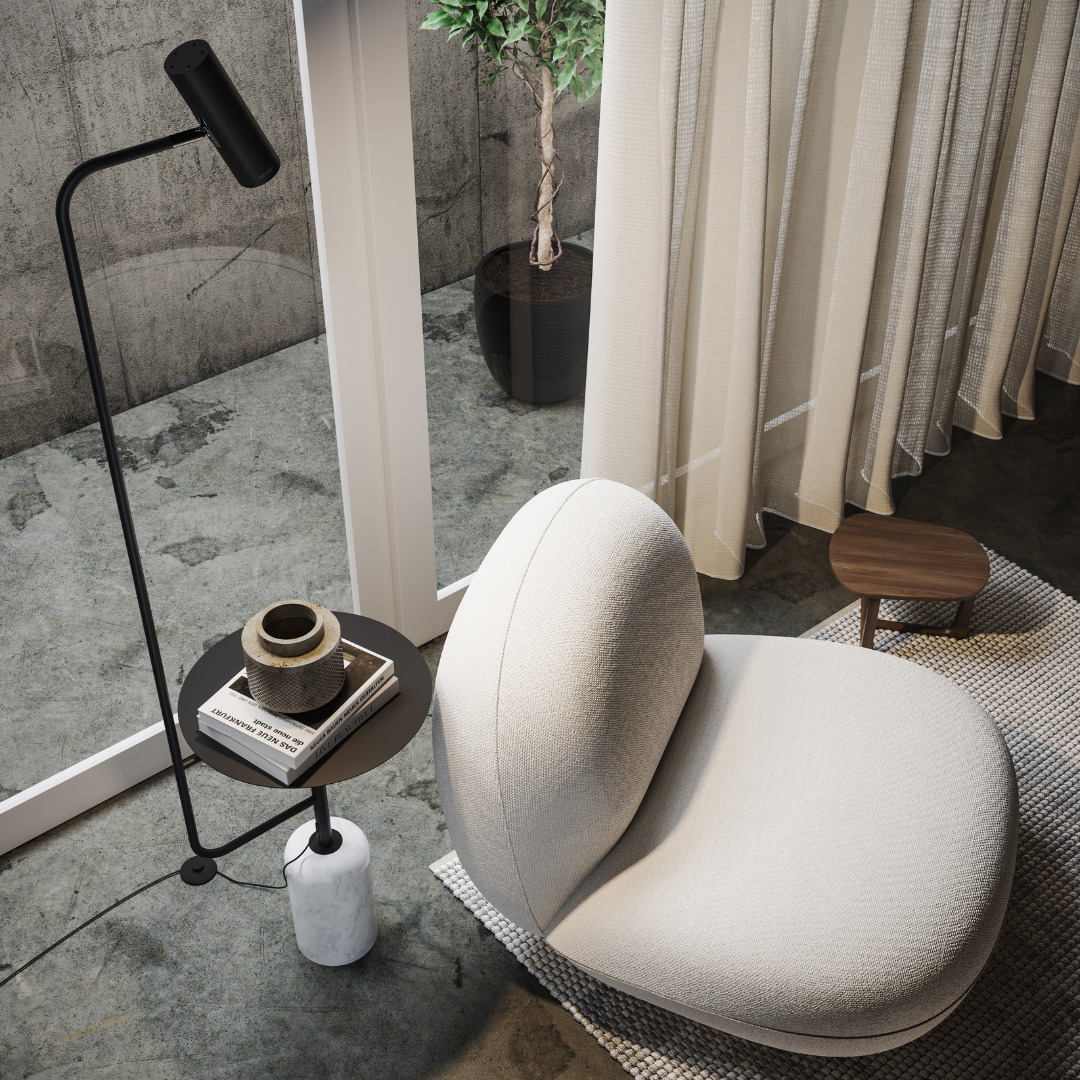 Overhead view of the black floor lamp's shelf holding books and a cup