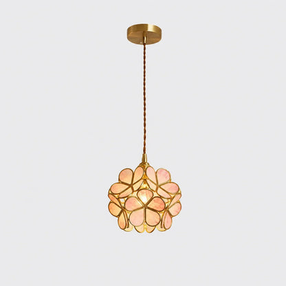 Pink floral glass petal pendant light with a metallic finish, featuring a delicate flower-shaped shade suspended by a twisted cable against a plain backgro