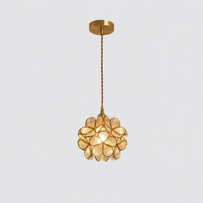 Floral glass petal pendant light with a warm glowing bulb, featuring transparent glass petals and a metallic finish, suspended by a twisted cable.