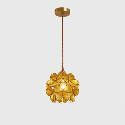 Yellow floral glass petal pendant light with a textured finish, suspended by a twisted cable from a matching metallic ceiling rose on a plain background.