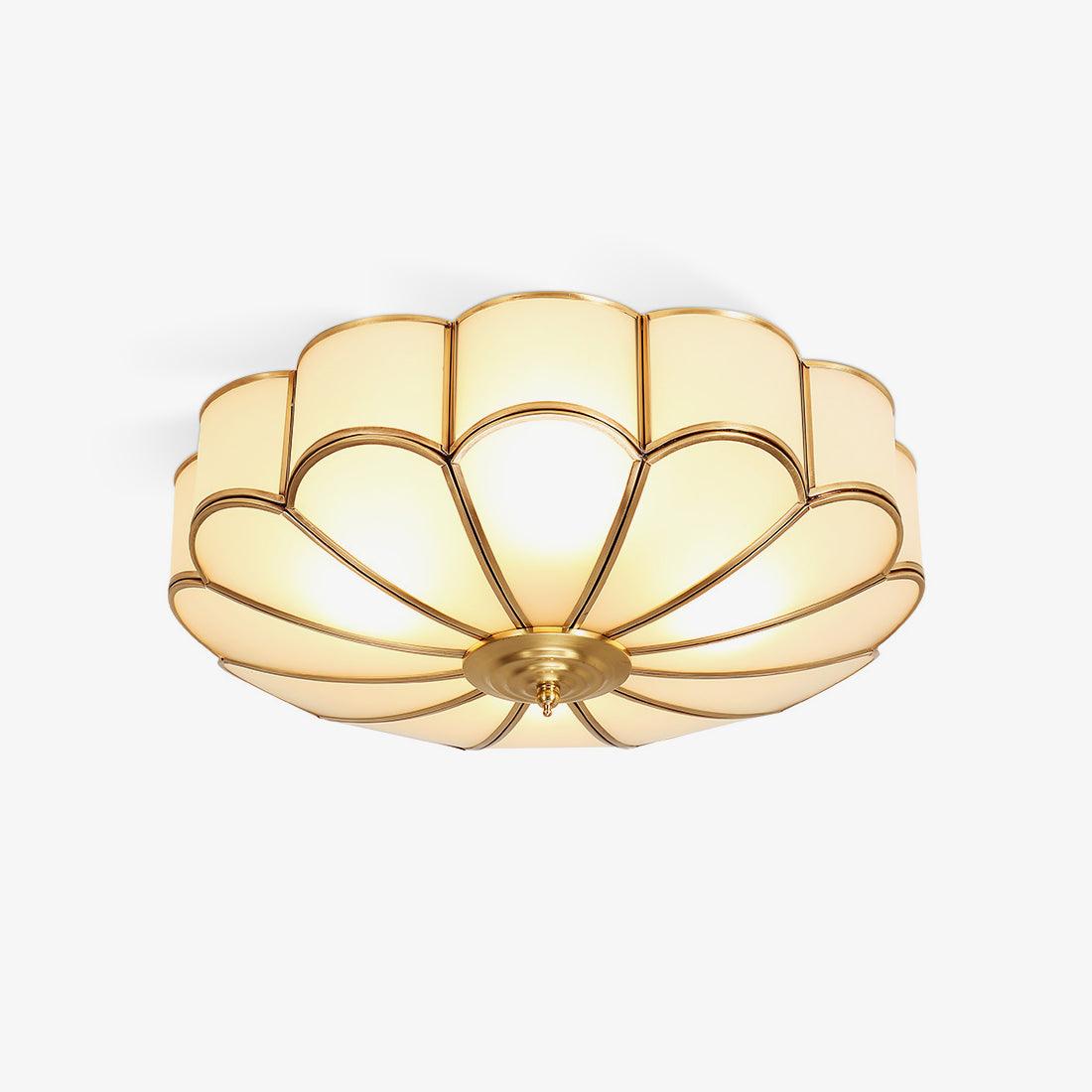 Brass-framed flower ceiling light with an illuminated frosted glass shade