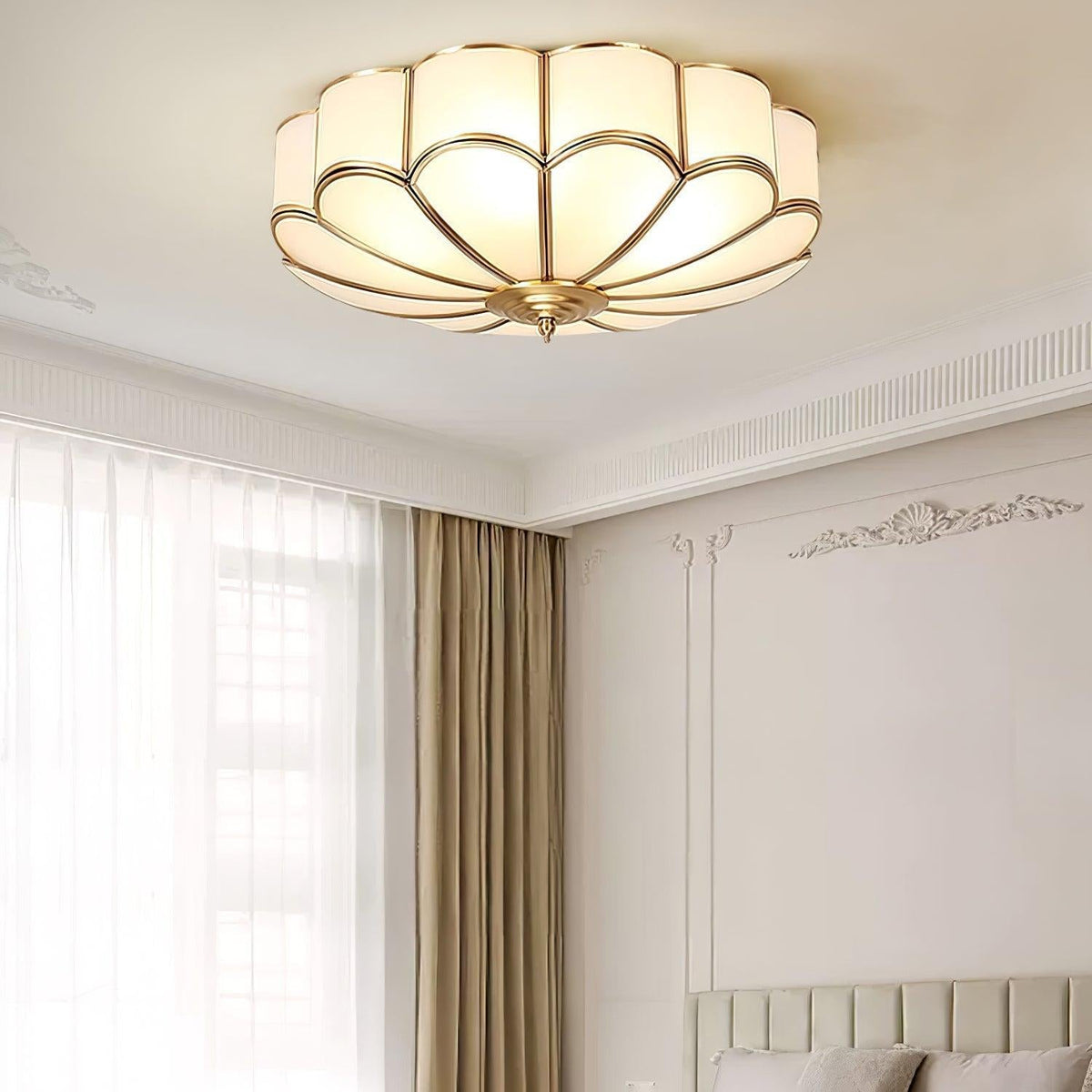 Flower-shaped glass ceiling light above a bedroom