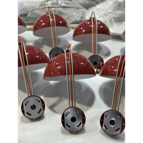 Double-dome wall lamps during assembly