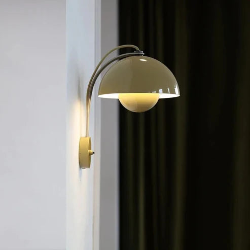 Dome wall lamp beside a window