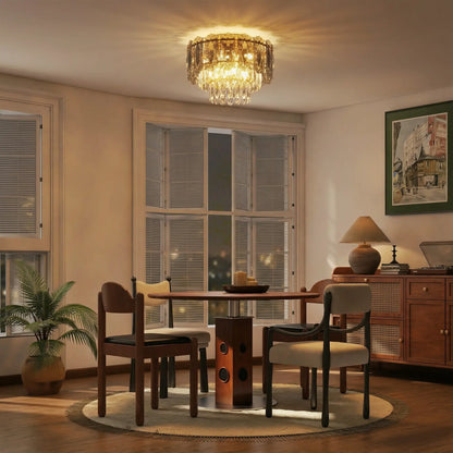 Illuminated chandelier above a dining table