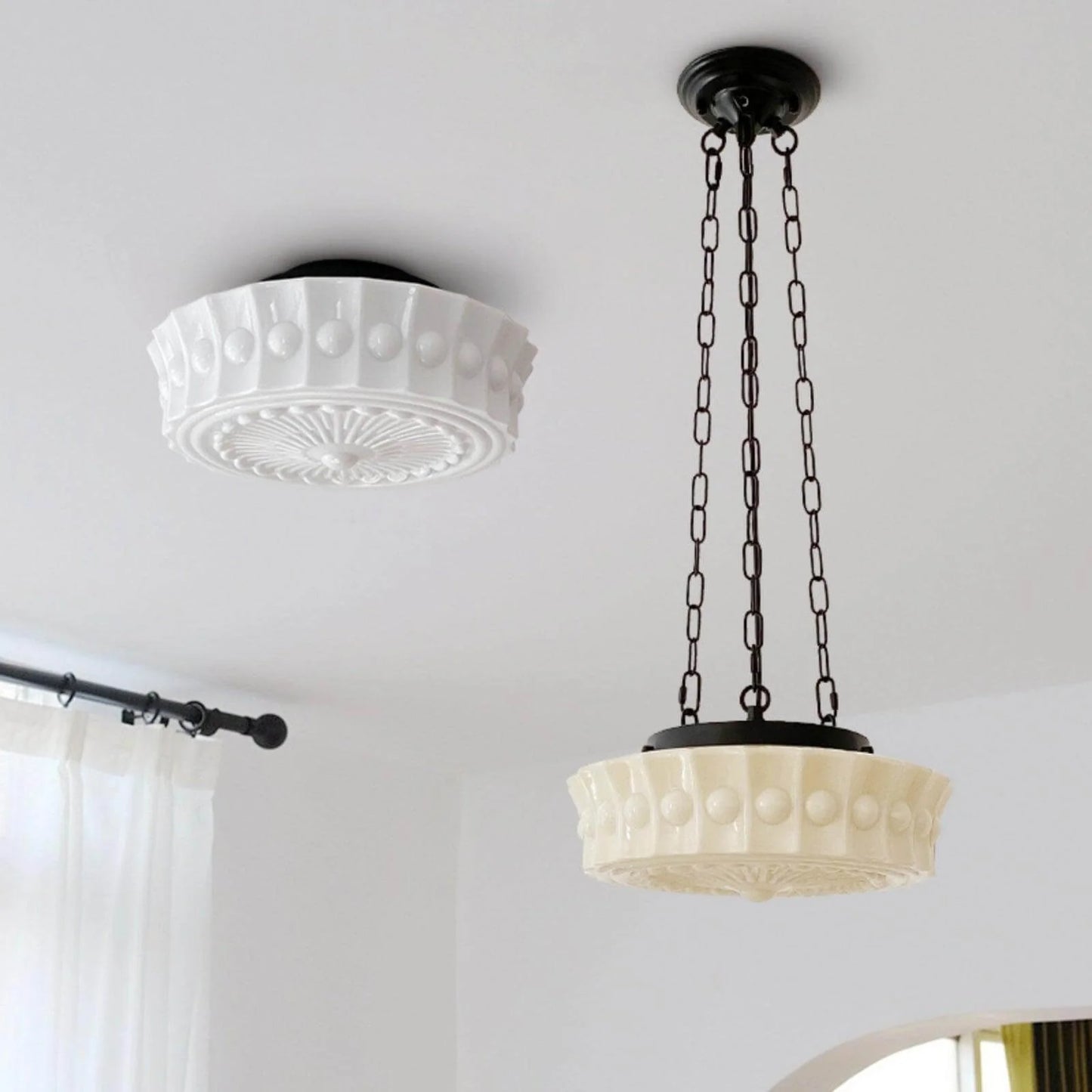 French vintage style ceiling lights featuring a white flushmount fixture alongside a matching pendant light with a decorative glass shade and chain.