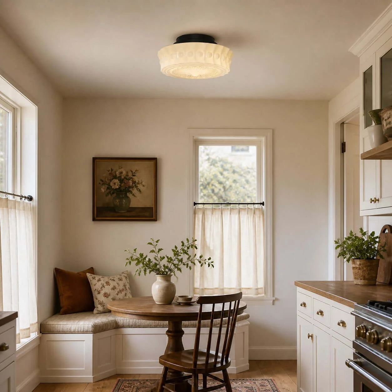 French vintage flushmount ceiling fixture with a textured glass shade installed in a cosy, traditional kitchen breakfast nook with wooden furniture.