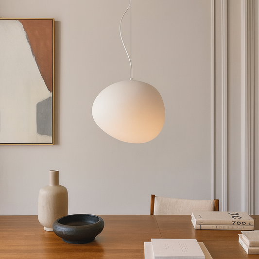 Frosted glass globe pendant light above a tabletop