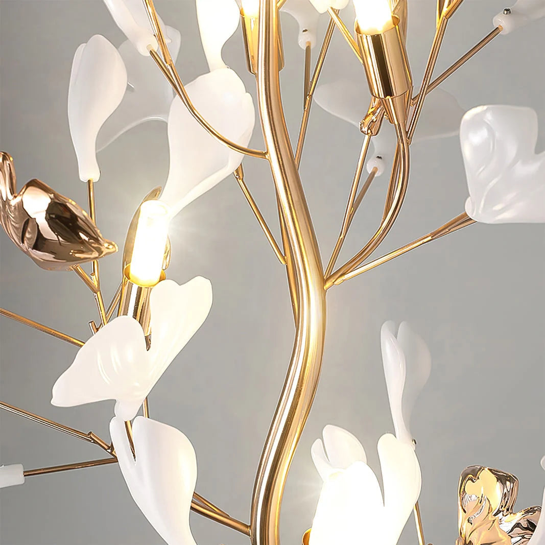 Close-up of the Ginkgo Leaf LED floor lamp showing gold-coloured branches, glowing lights, and delicate white and gold ginkgo leaf decorations.