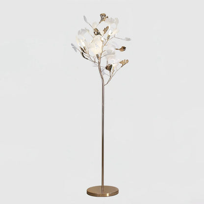 An elegant gold LED floor lamp featuring a branch-like design with illuminated white and gold ginkgo leaves on a circular base.