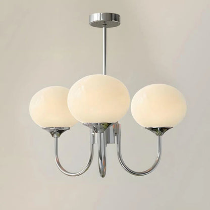 A modern 3-light pendant ceiling light featuring a polished chrome metal frame and three spherical white glass ball shades against a neutral background.