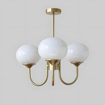 A modern three-light pendant ceiling light featuring three spherical white glass globes supported by a curved, gold-coloured metal frame.