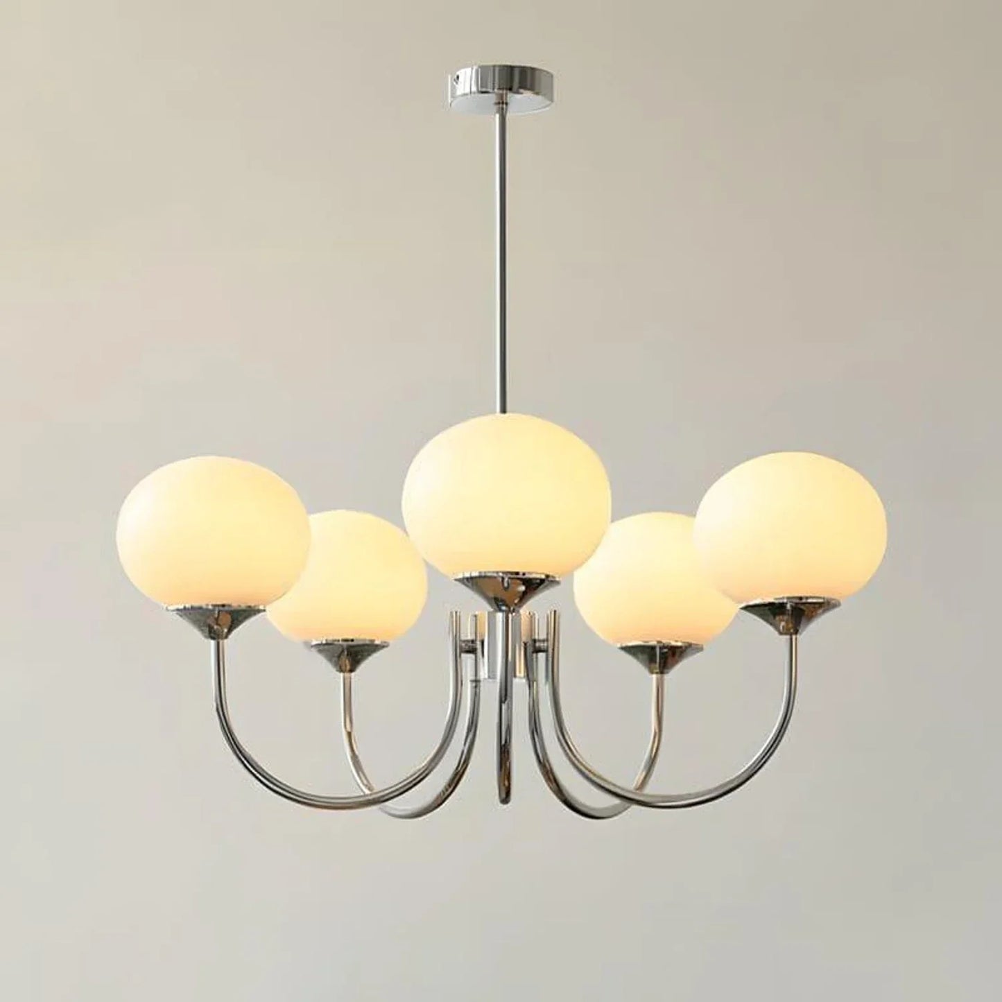 Modern 5-light pendant ceiling light featuring a polished chrome frame with five spherical cream glass ball shades, measuring 67cm in diameter.
