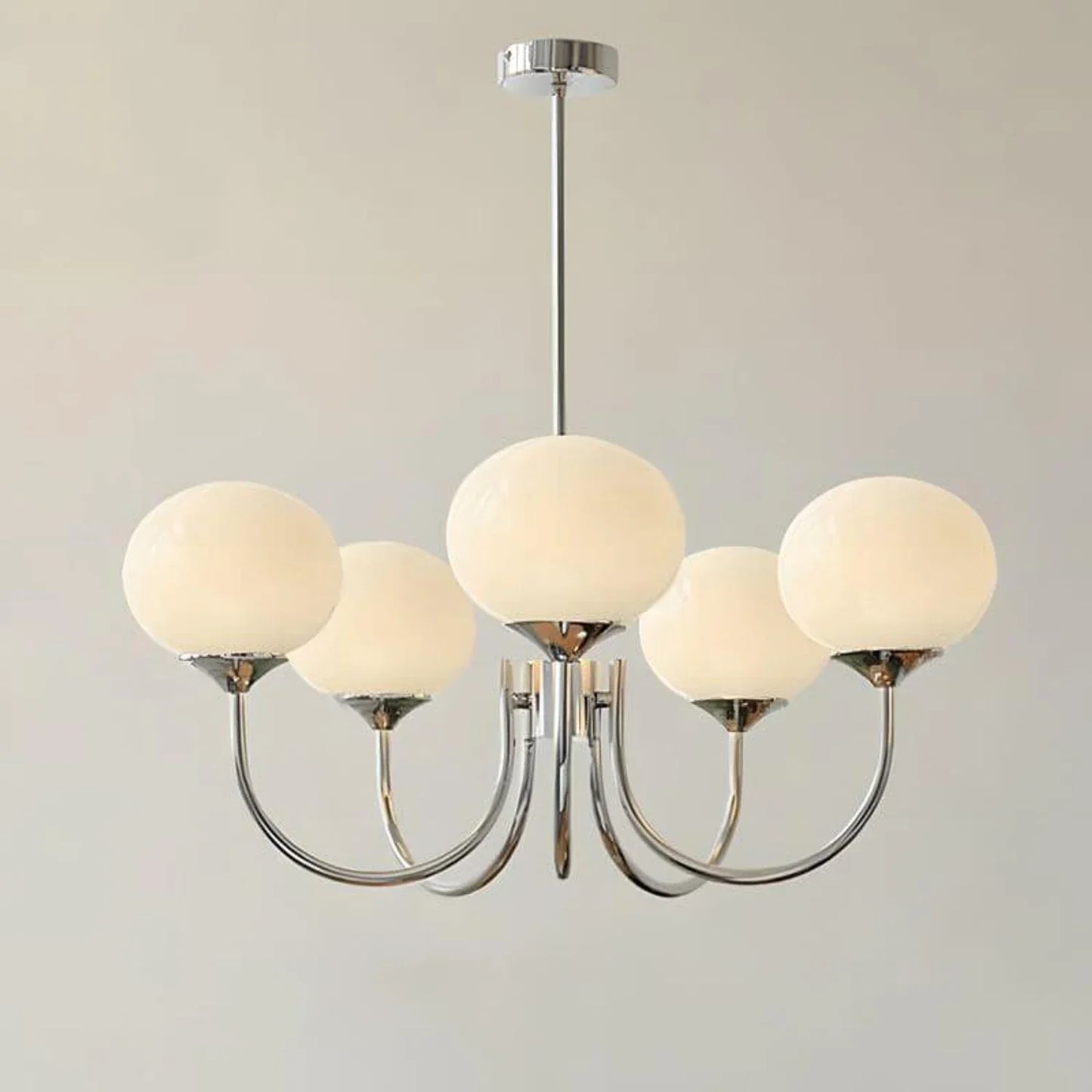 Modern 5-light pendant ceiling fixture with curved chrome arms and five spherical white glass globes, ideal for contemporary interior lighting.