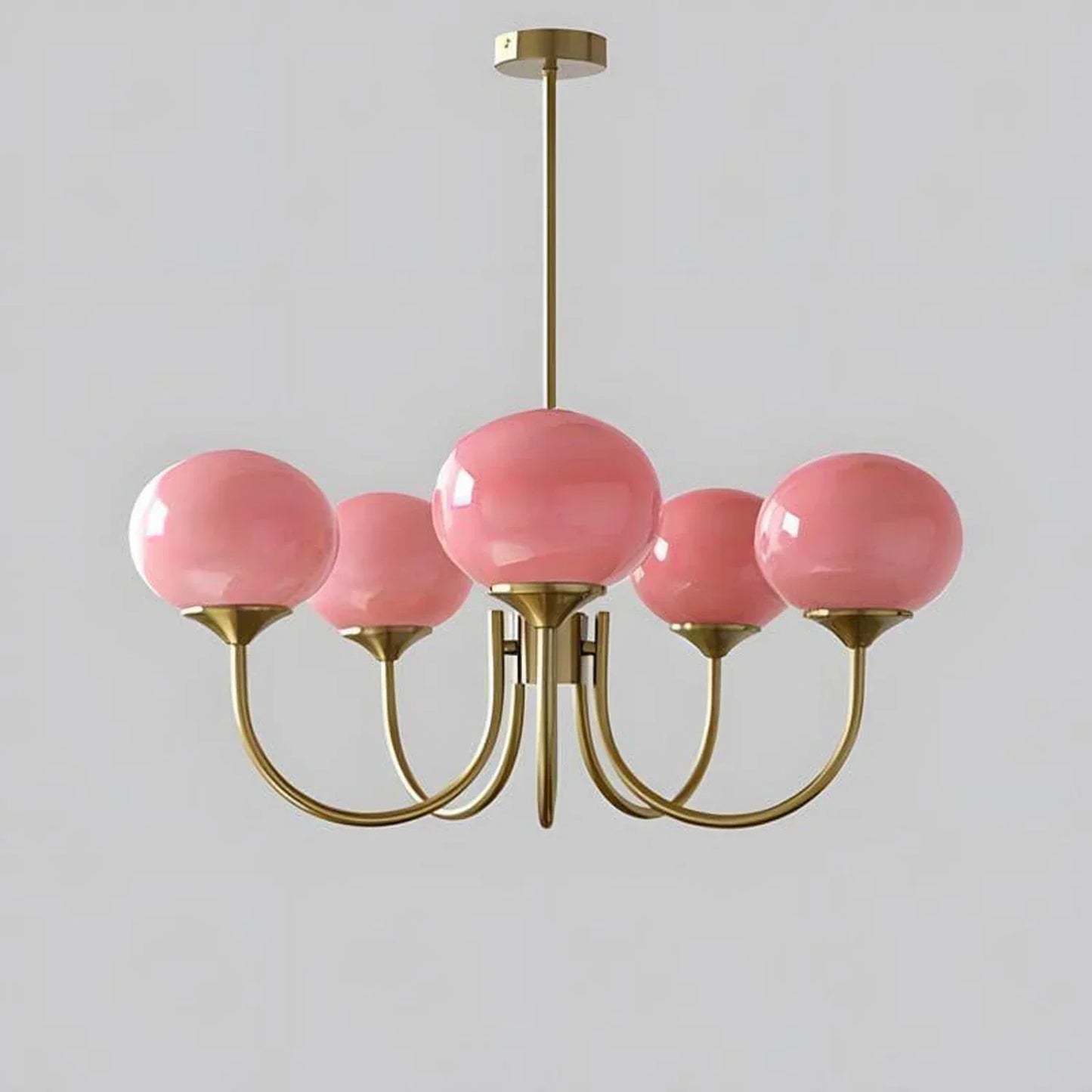 Modern 5-light pendant ceiling light featuring a copper finish frame with five spherical pink glass ball shades, measuring 67cm in diameter.