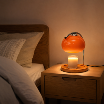 Glass candle warmer lamp with solid wood base detail