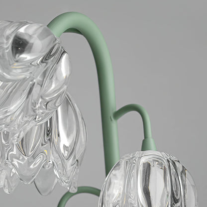 Glass blossoms hanging from curved green metal stems